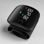 Wrist blood pressure monitor, angled view, showing the display and wrist strap