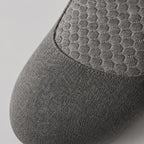 Close view of the honeycomb quilted panel and knitted grey cover