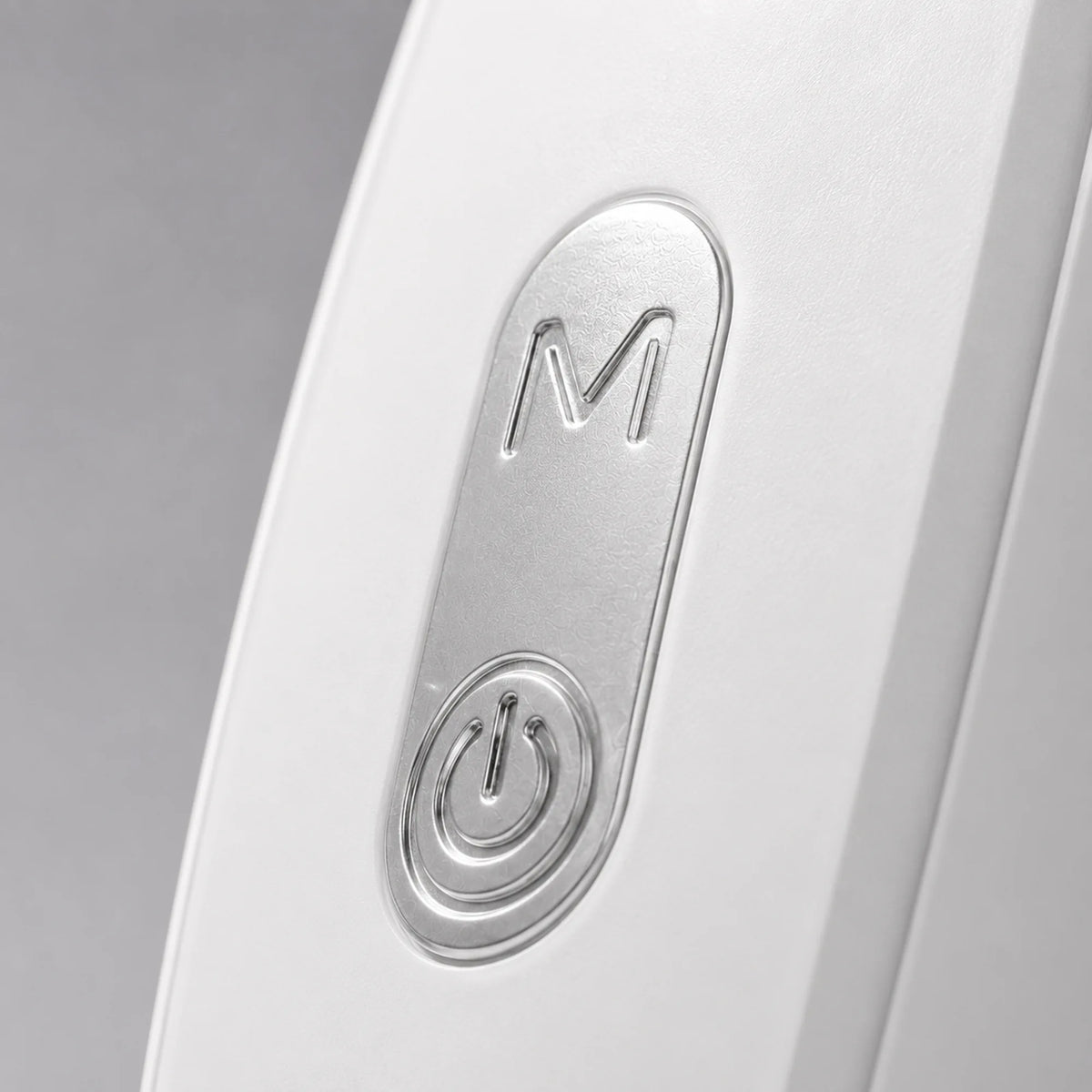 Close view of the mode and power buttons on the side of the neck massager