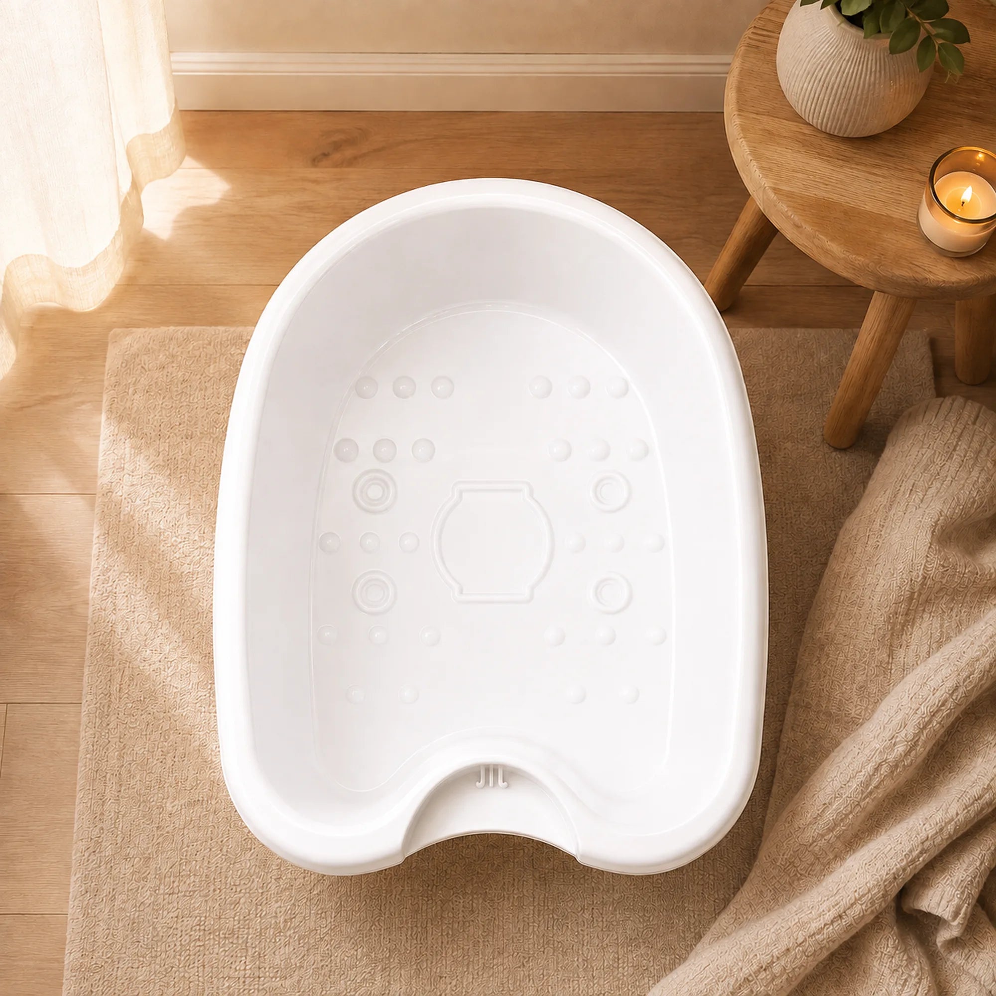 Top-down view of the empty ionic foot spa basin in a bathroom setting