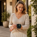 Woman checking her blood pressure reading on her wrist outdoors