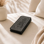 EMS foot massager pad folded in half resting on a cream blanket