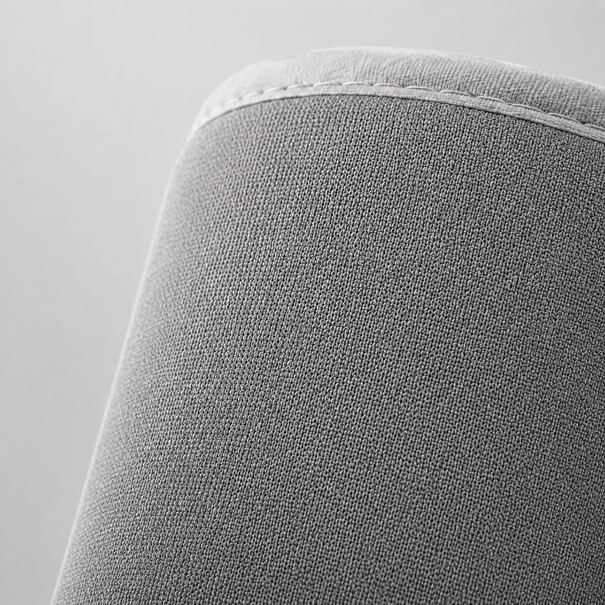 Extreme close-up of the calf massager wrap's fabric texture and stitched seam