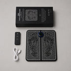 Box contents laid out: foot massager pad, wireless remote and USB charging cable